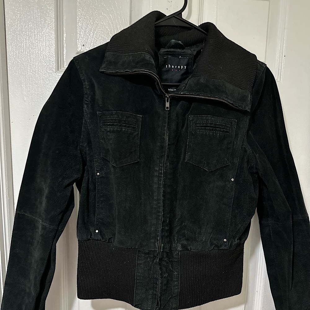 This is a black denim jacket, it has 4 functioning pockets and zipper!